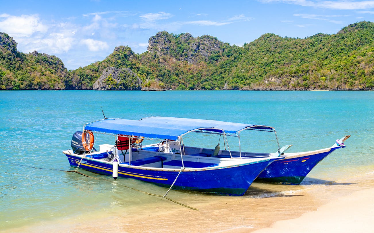 Speedboats navigating turquoise waters during Langkawi Island Hopping Tour.