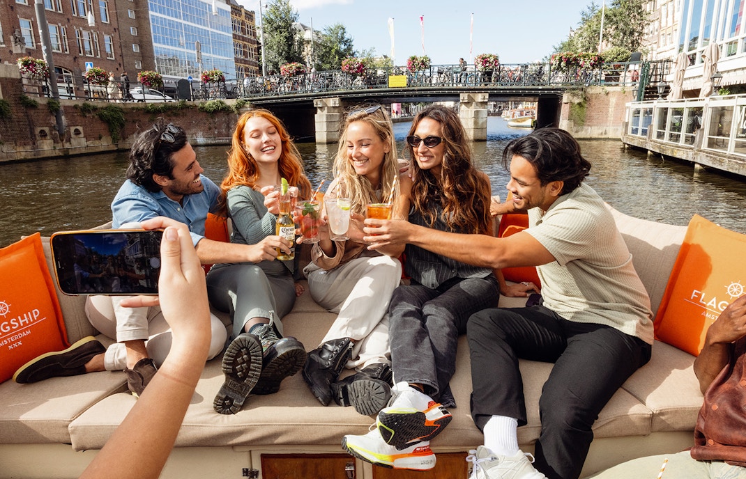 Tall ships sailing in Amsterdam harbor during SAIL Amsterdam event.