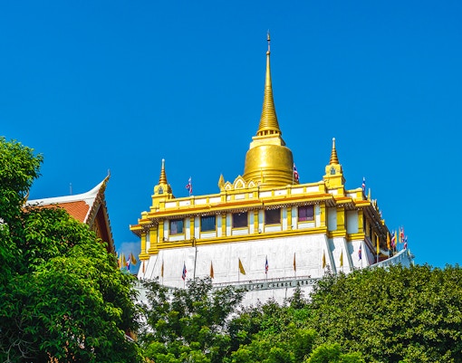 Golden Mount at Wat Saket, Bangkok, Thailand with blue sky.