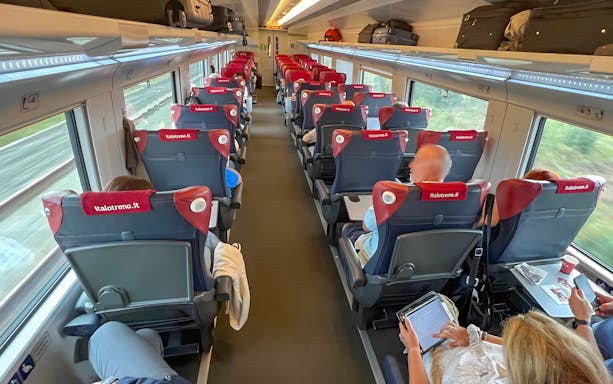 Passengers seated in Italo high-speed train from Florence to Rome.