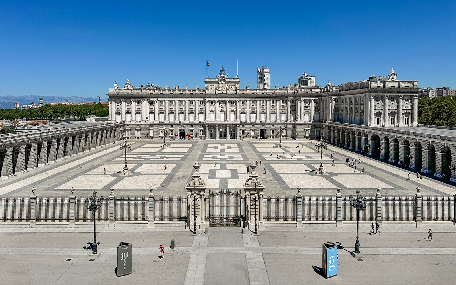 Royal Palace of Madrid courtyard with tourists, Spain.