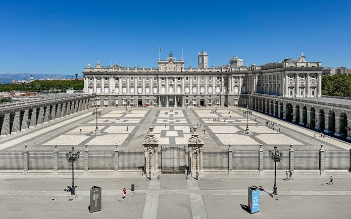 Royal Palace of Madrid courtyard with tourists, Spain.