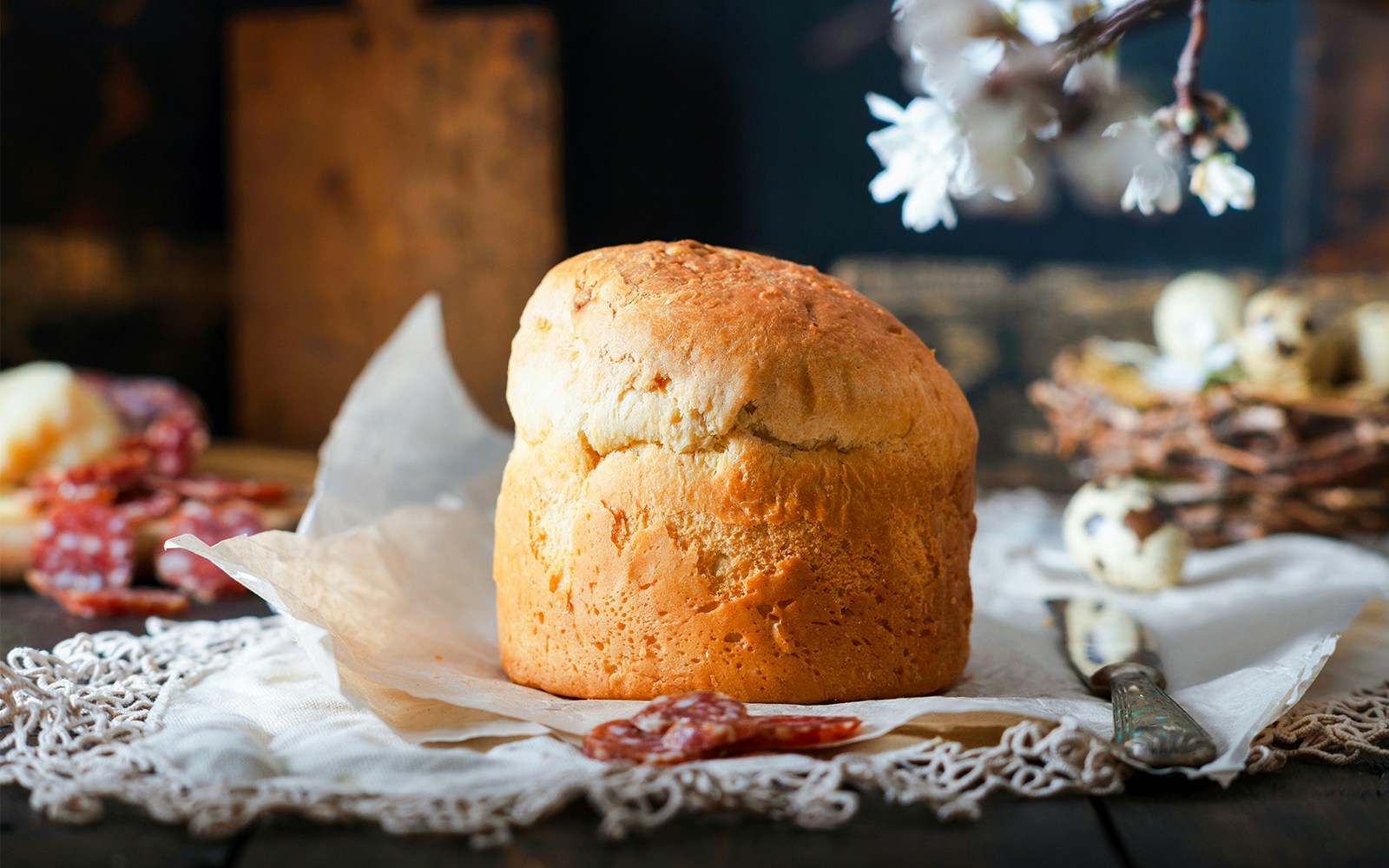 Schiacciata di Pasqua, traditional Italian Easter cake with cheese, on a wooden table.