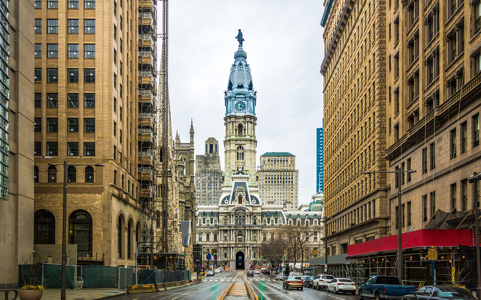Philadelphia City Hall with surrounding buildings on a cloudy day.