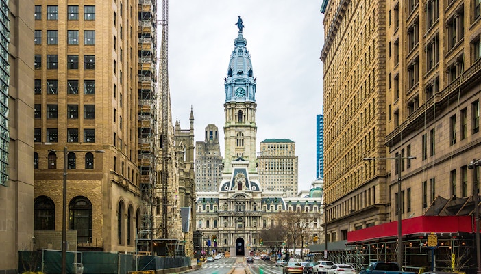 Philadelphia City Hall with surrounding buildings on a cloudy day.