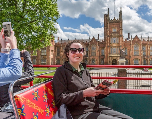Tourists exploring the Giant's Causeway on the Belfast Hop-On Hop-Off Bus Tour, a unique Game of Thrones filming location in Belfast, Northern Ireland