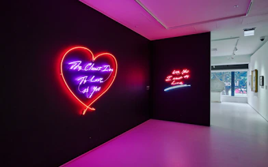 Neon heart art installation at Moco Museum London exhibit.