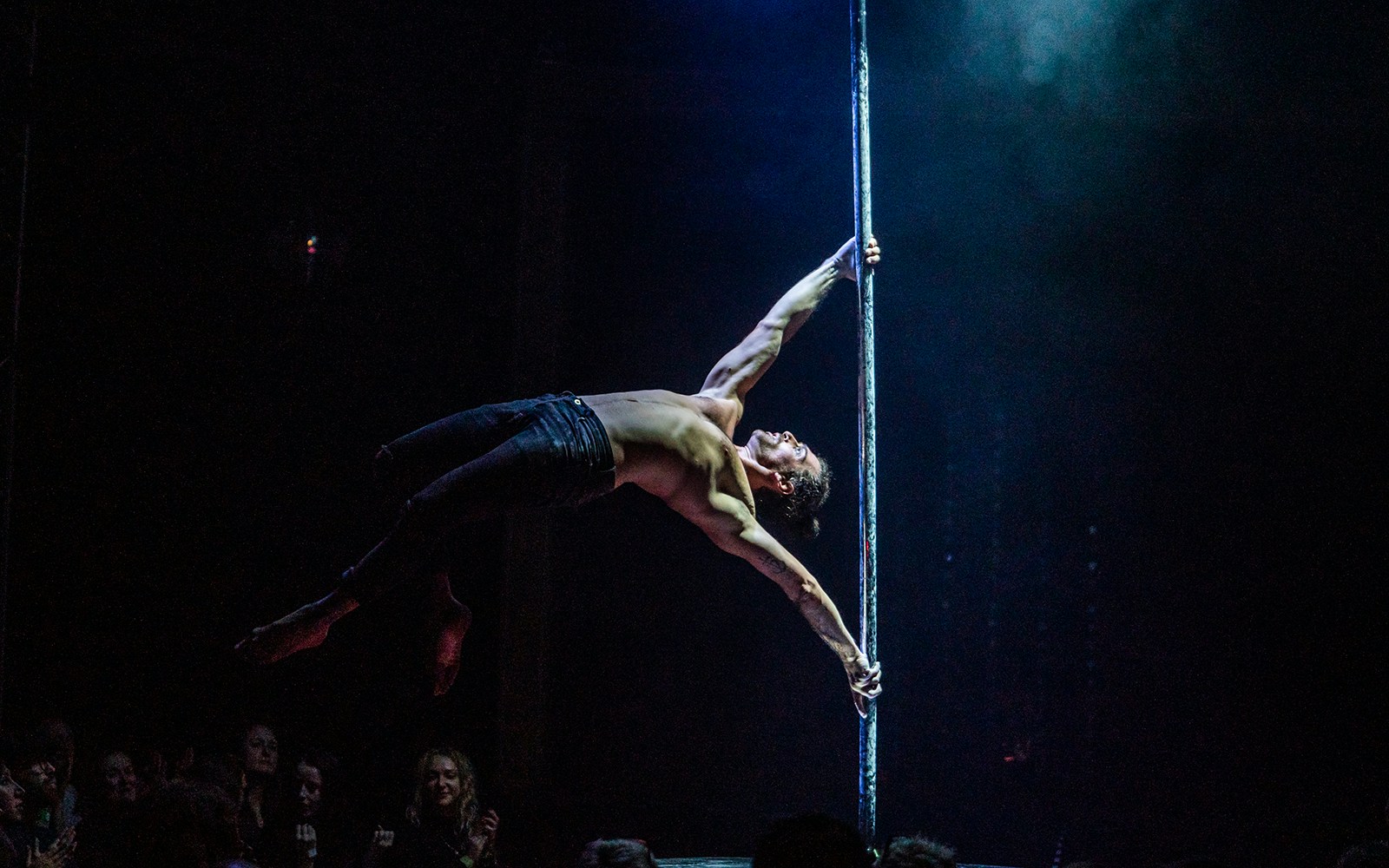 Performers on stage at La Clique show in London, featuring acrobatics and cabaret acts.