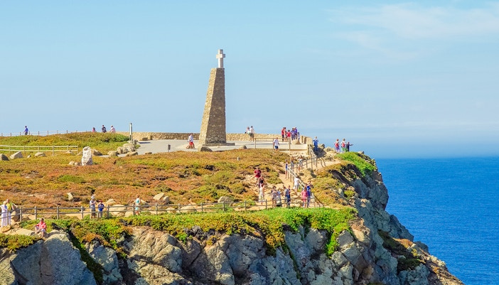 Cross monument and viewpoint at Cabo da Roca, Portugal, overlooking the Atlantic Ocean.
