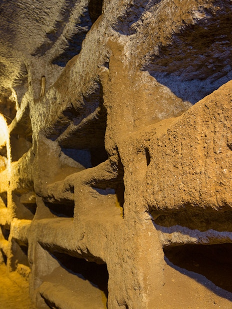 Catacomb passageway with niches on the Appian Way, Italy.