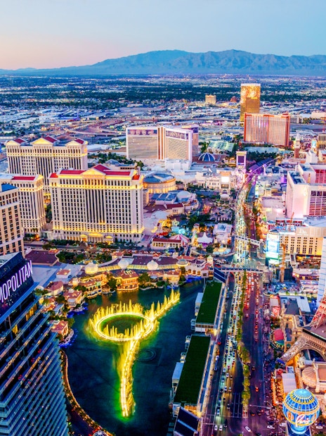 Aerial view of Las Vegas Strip at night with neon lights and fountains, Nevada.