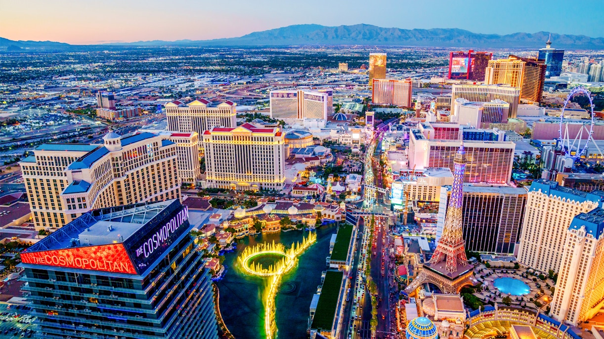 Aerial view of Las Vegas Strip at night with neon lights and fountains, Nevada.