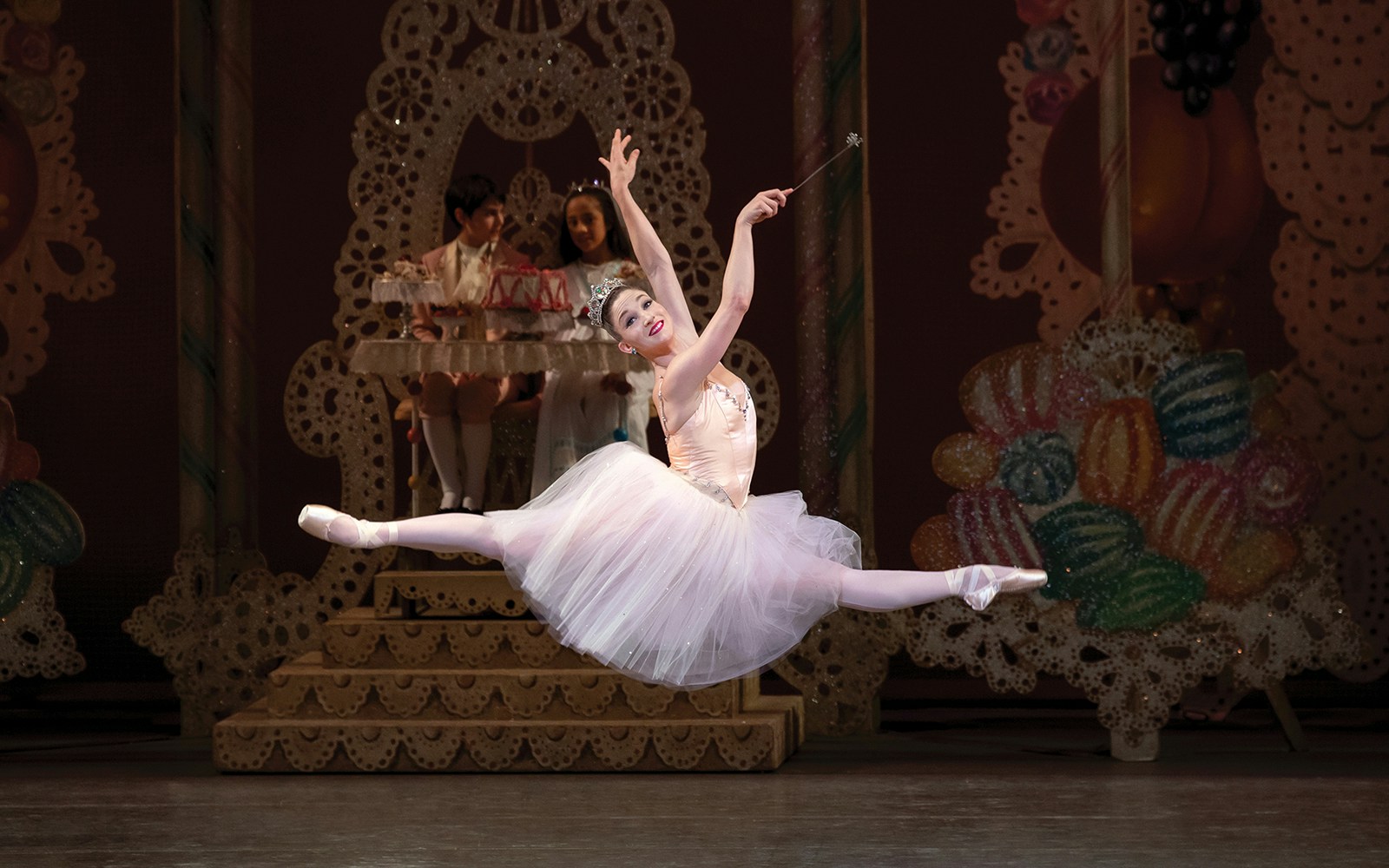 Ballerina performing a grand jeté in New York City Ballet's The Nutcracker.