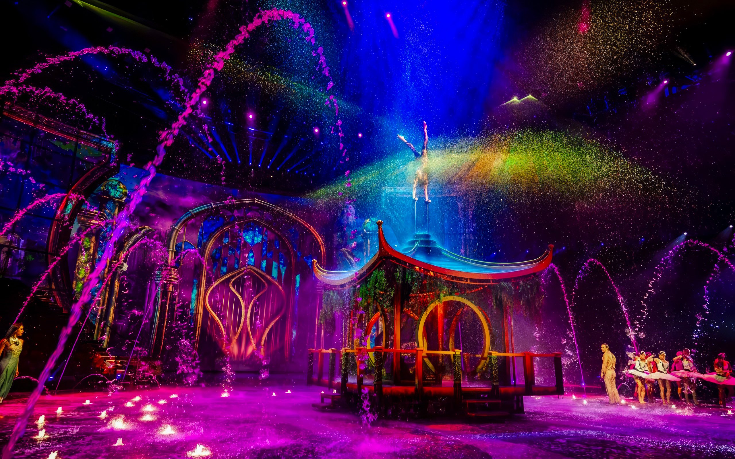 Water jets and colorful lights at House of Dancing Water Show performance.