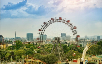 Vienna Prater Ferris wheel with city skyline in the background.