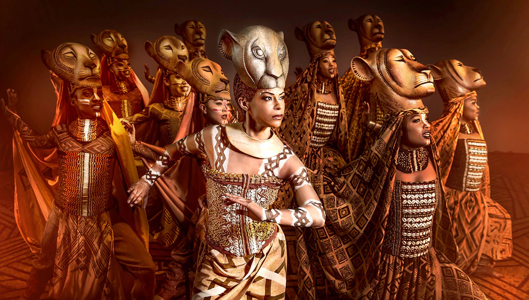 Performers in lion costumes from Der König der Löwen musical.
