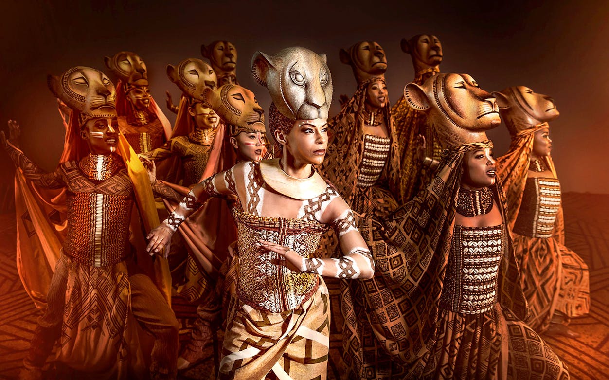 Performers in lion costumes from Der König der Löwen musical.