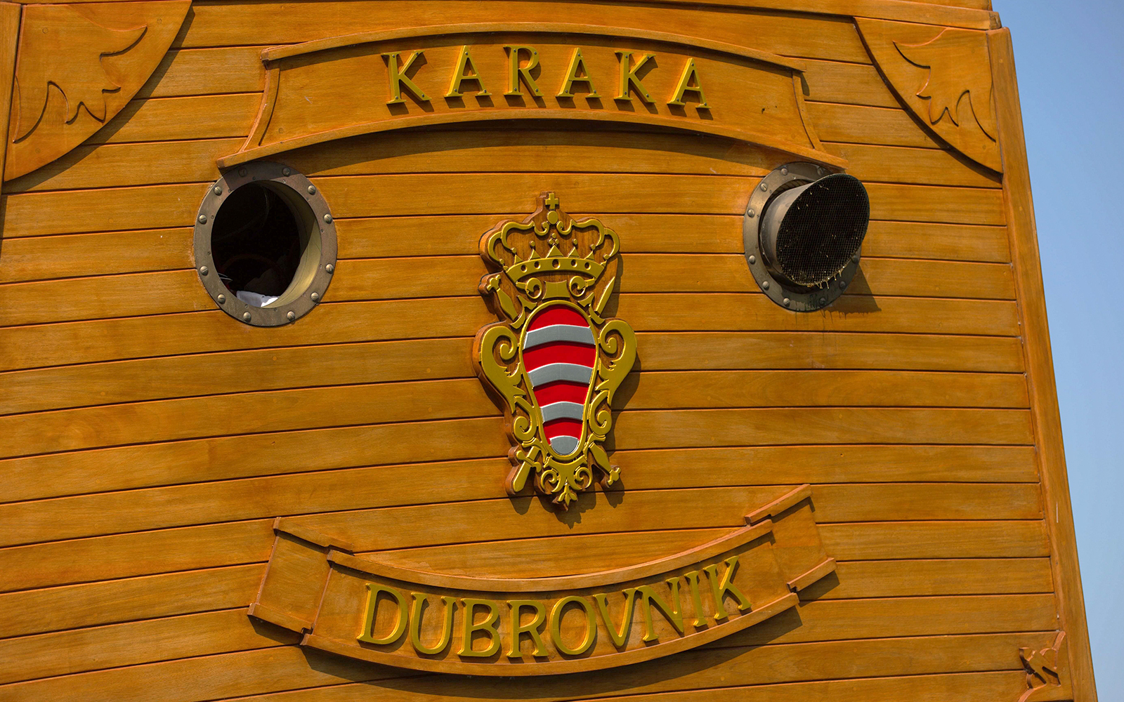 Karaka ship detail with Dubrovnik emblem for Elaphite Islands cruise.