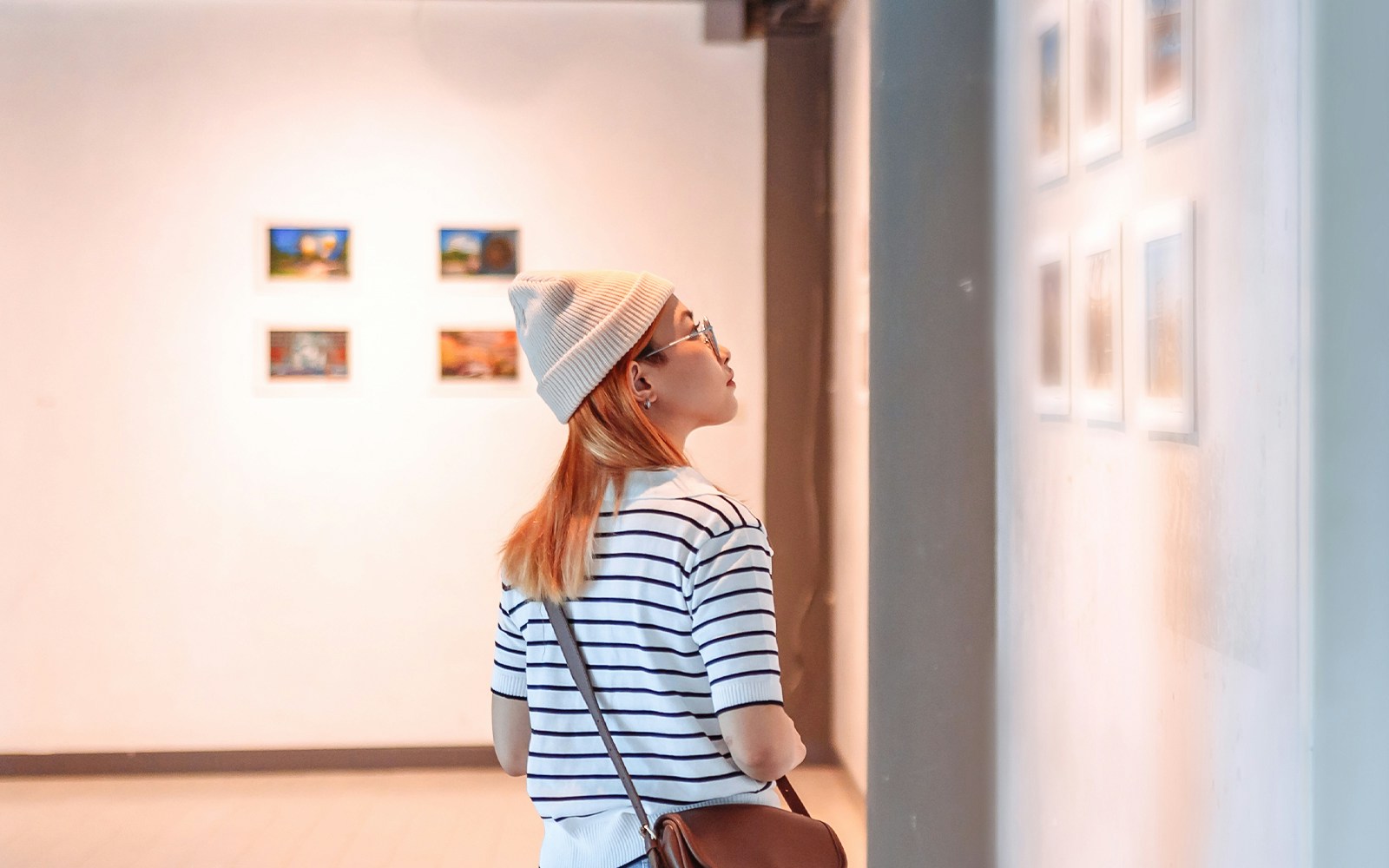 Visitor viewing art at Moco Museum, Barcelona.