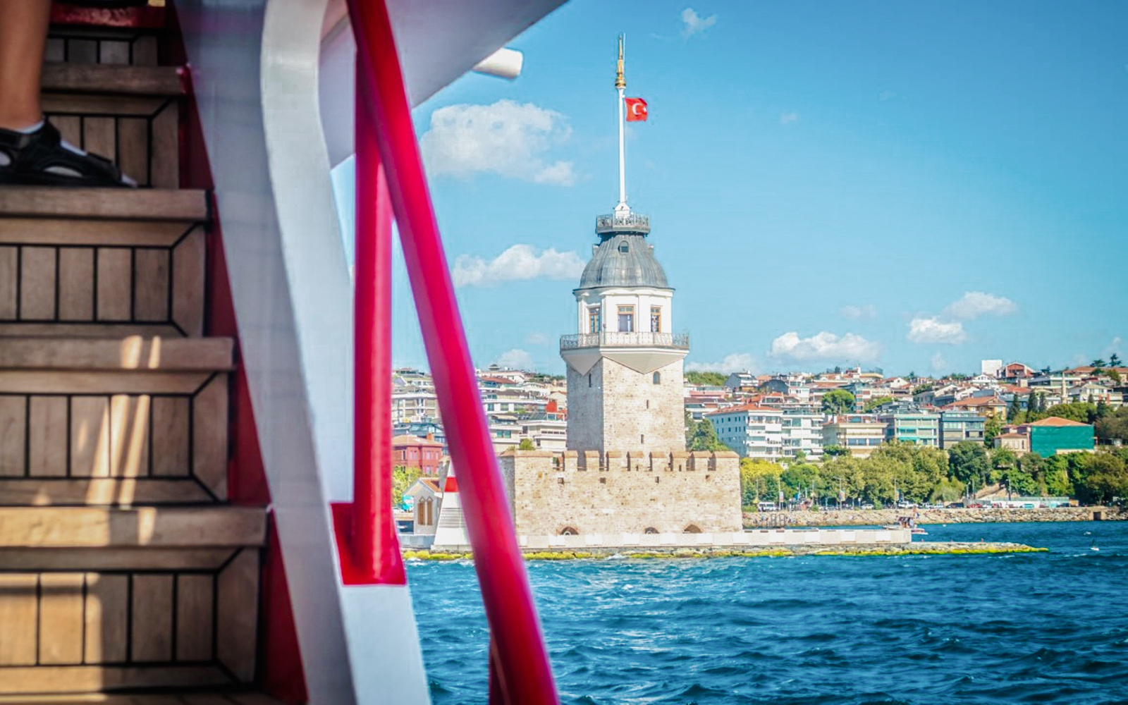 Maiden's Tower view from Bosphorus cruise with cityscape in the background.