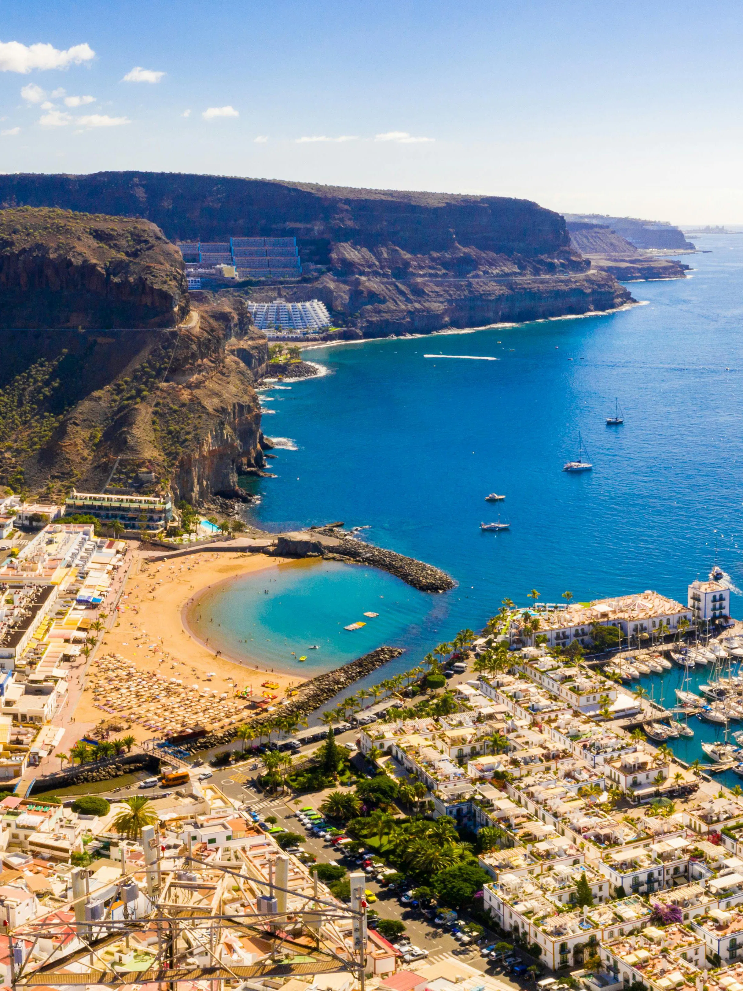 Aerial view of Puerto de Mogan town, beach, and marina on Gran Canaria, Spain.