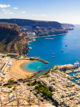 Aerial view of Puerto de Mogan town, beach, and marina on Gran Canaria, Spain.
