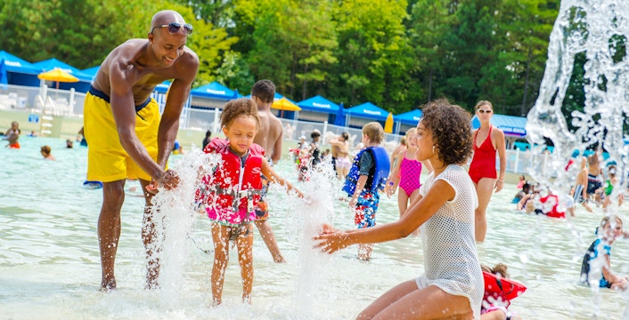 Children playing in the wave pool at Hurricane Harbor, Six Flags New Jersey.