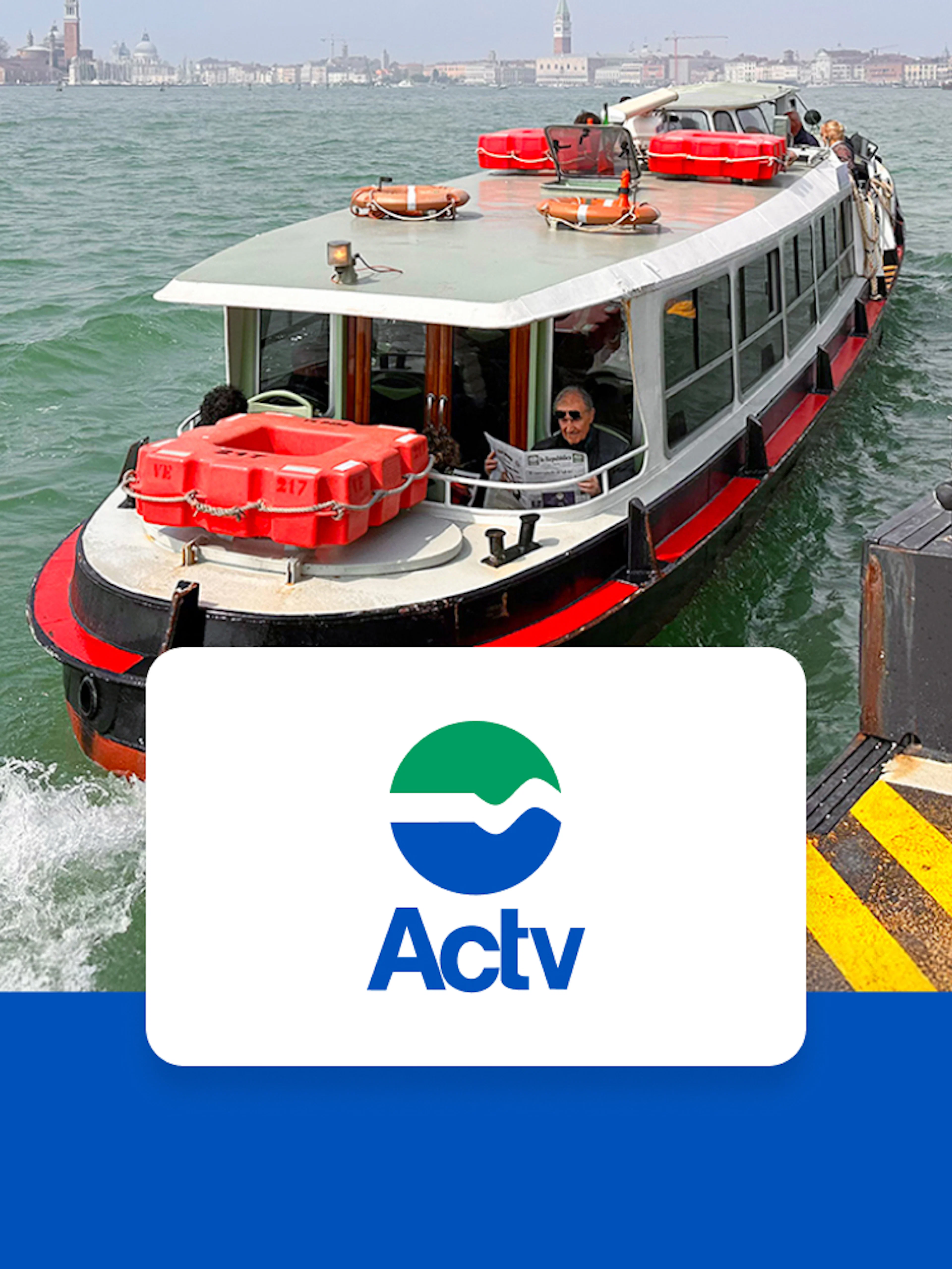 Venice ACTV water bus approaching dock with cityscape in background.
