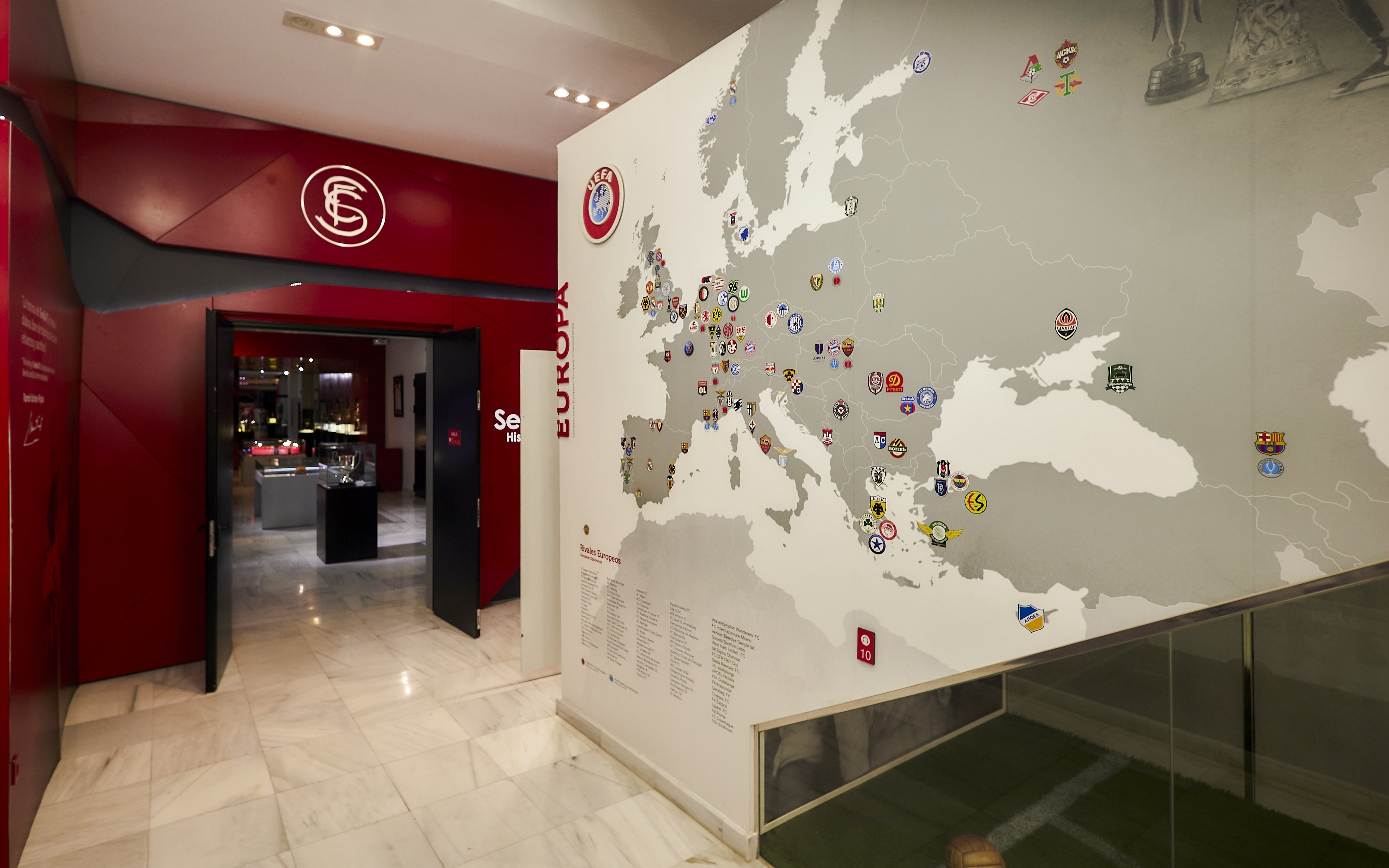Sevilla FC museum entrance with European football club map display.