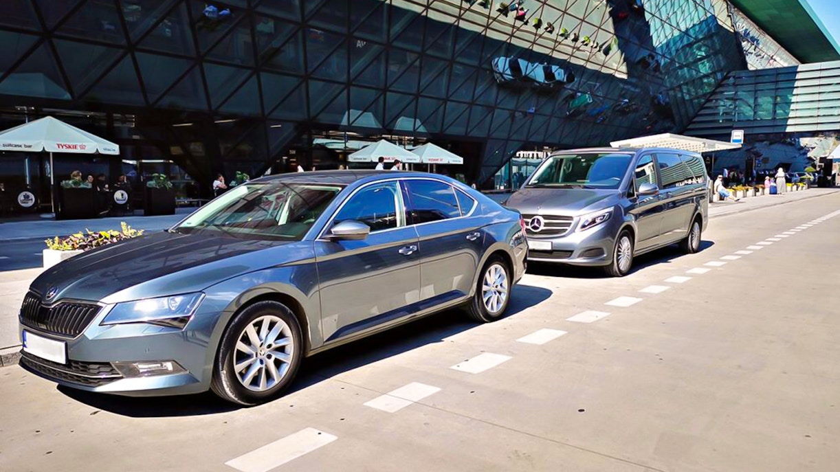 Transfer vehicles parked at Krakow Balice Airport for Zakopane route.