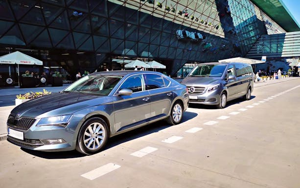 Transfer vehicles parked at Krakow Balice Airport for Zakopane route.