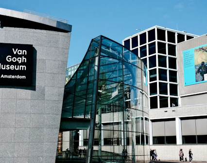 Van Gogh Museum entrance with modern glass architecture in Amsterdam.