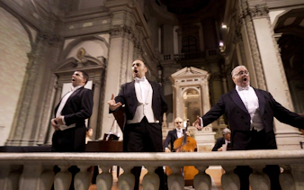 Three tenors performing in a historic Florence venue during a Tuscan dinner concert.