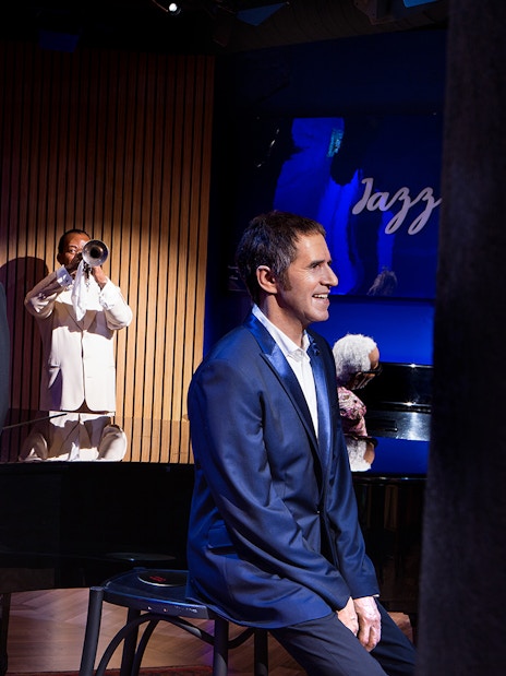 Wax figures of musicians and performers at Grévin Paris Wax Museum.