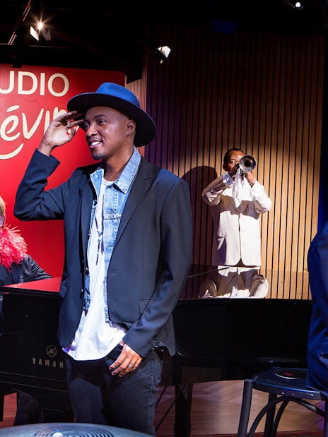 Wax figures of musicians and performers at Grévin Paris Wax Museum.