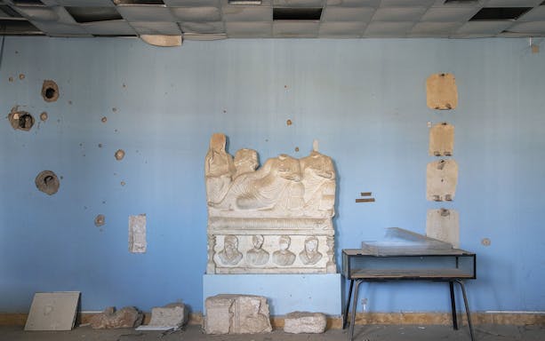 Ancient stone relief and artifacts in Fundación MAPFRE Madrid's Sala Recoletos.