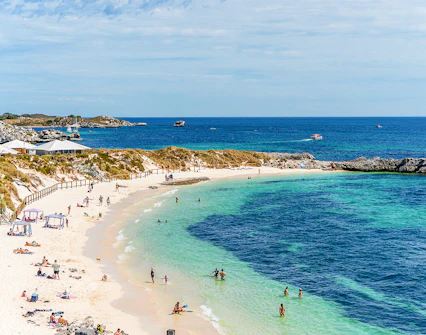 People enjoying the sun and sea at Pinky Beach, Rottnest Island.