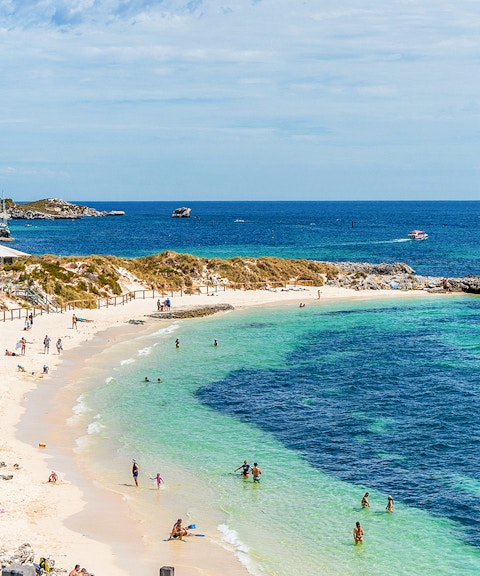 People enjoying the sun and sea at Pinky Beach, Rottnest Island.