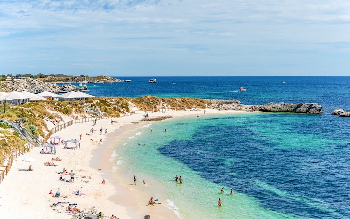 People enjoying the sun and sea at Pinky Beach, Rottnest Island.