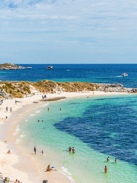 People enjoying the sun and sea at Pinky Beach, Rottnest Island.