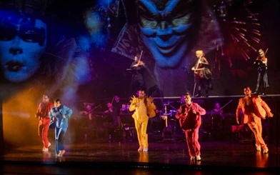 Performers in colorful costumes at Vivaldianno The SHOW, Theatre Hybernia, Prague.