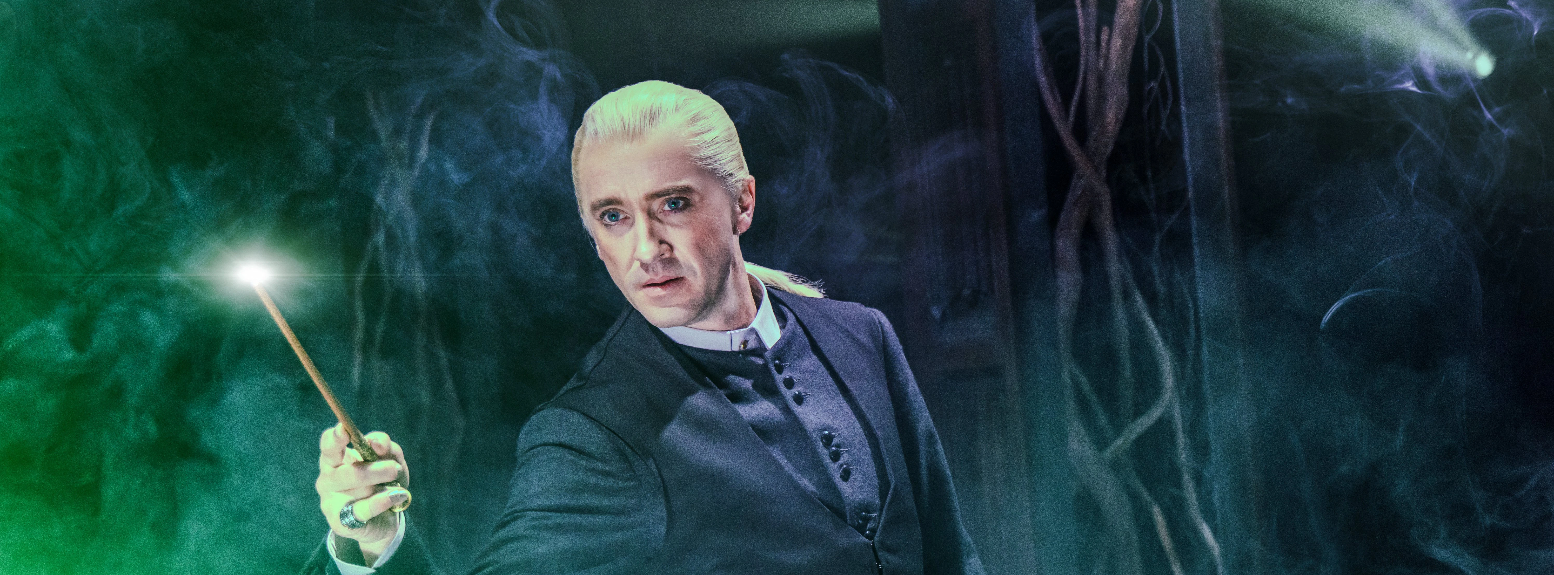 Performer with wand in Harry Potter and the Cursed Child, Broadway stage.