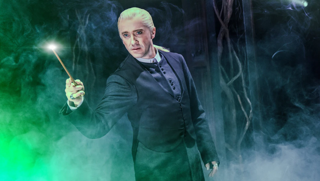 Performer with wand in Harry Potter and the Cursed Child, Broadway stage.