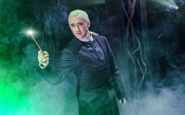 Performer with wand in Harry Potter and the Cursed Child, Broadway stage.