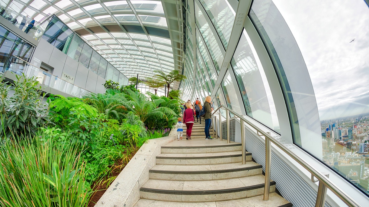 Visitors walking through lush greenery at The Sky Garden, 20 Fenchurch Street, London.