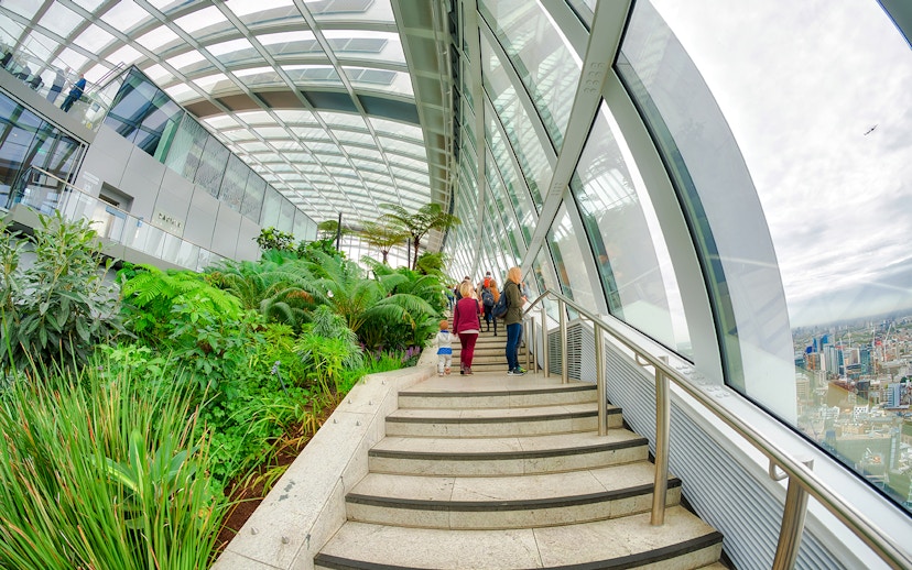 Visitors walking through lush greenery at The Sky Garden, 20 Fenchurch Street, London.
