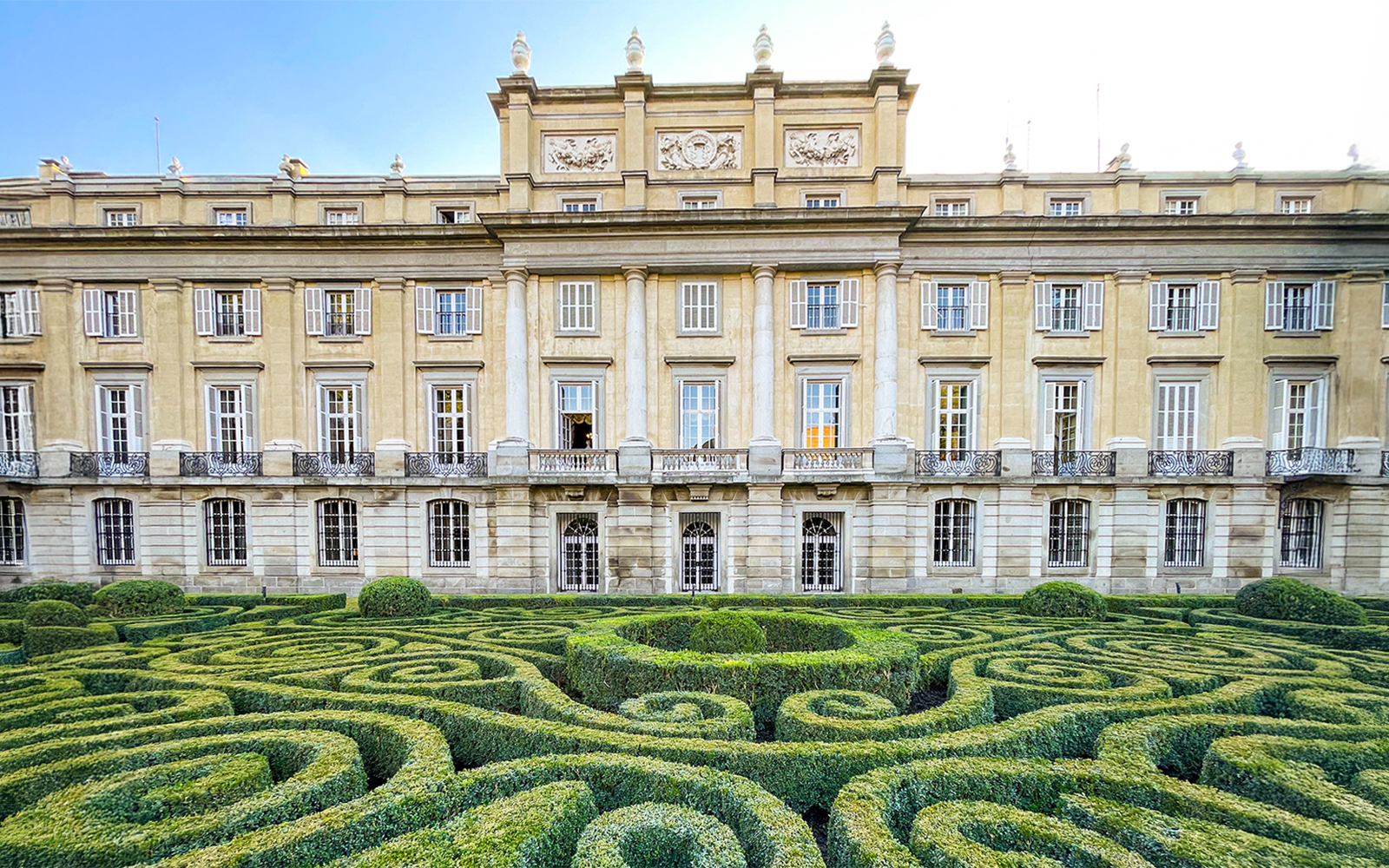Liria Palace exterior with lush garden in Madrid, Spain.