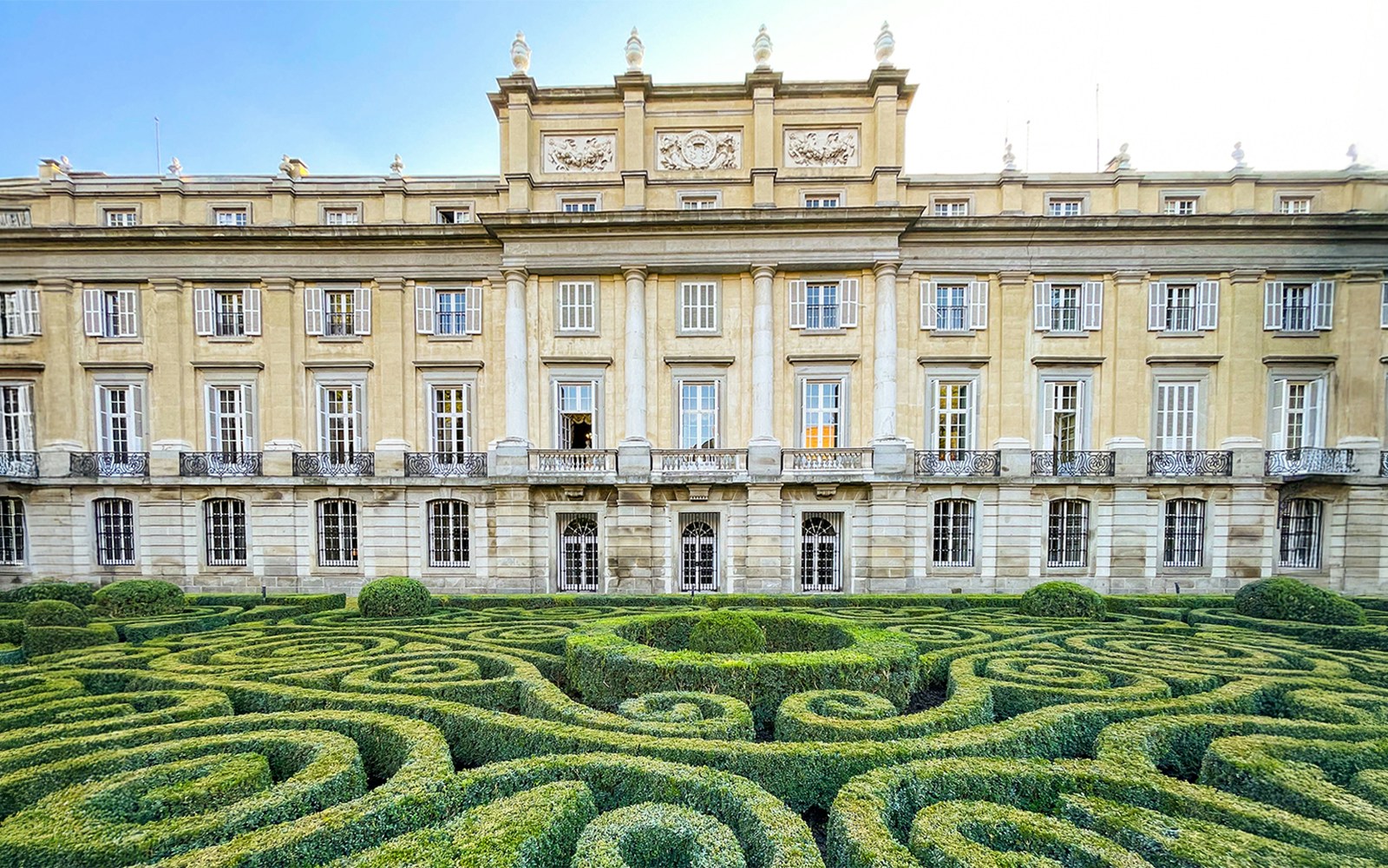 Liria Palace exterior with lush garden in Madrid, Spain.