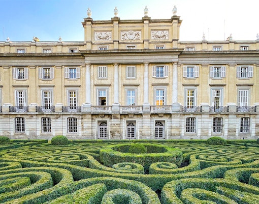 Liria Palace exterior with lush garden in Madrid, Spain.