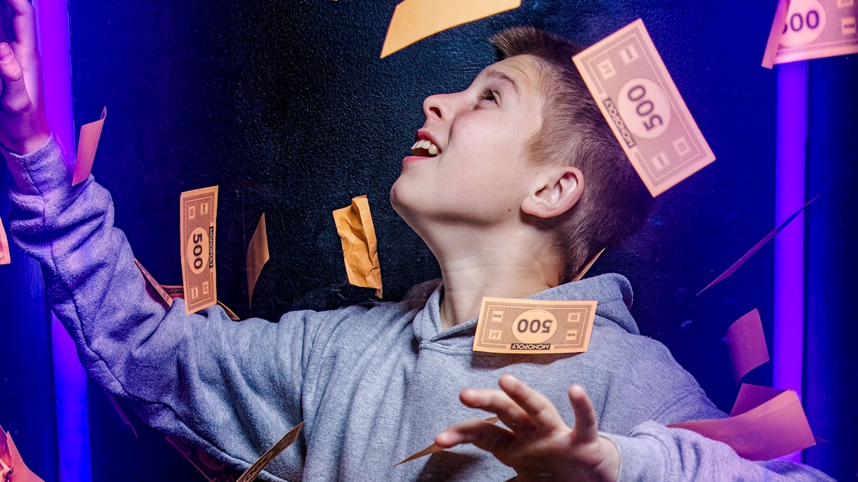 Guests playing a life-sized Monopoly game at Monopoly Lifesized experience in London.